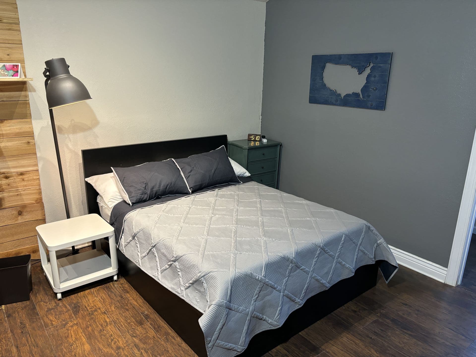 Cozy bedroom with queen bed and modern decor